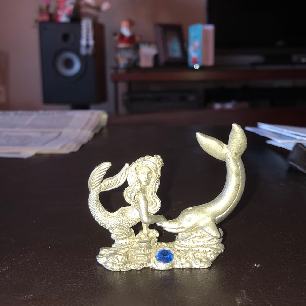Puter mermaid and dolphin figurine